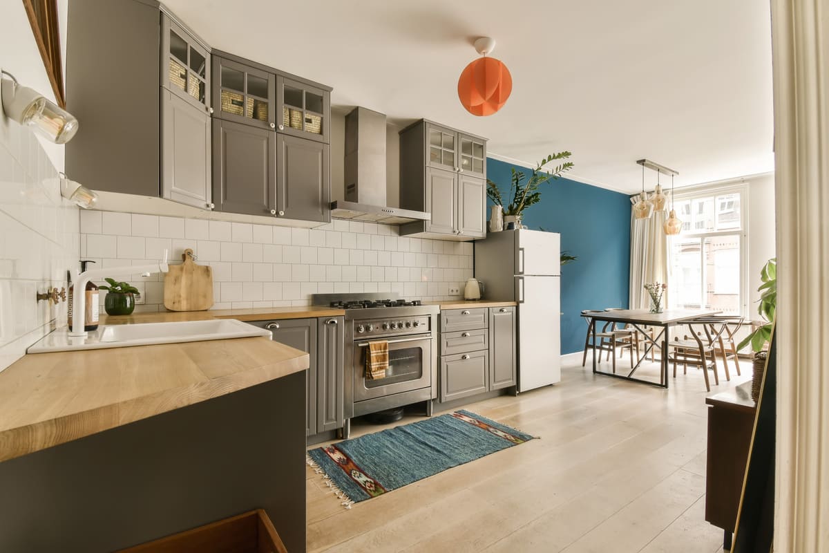 a-kitchen-with-gray-cabinets-and-a-white-2025-02-10-12-12-45-utc (1) (1).jpg