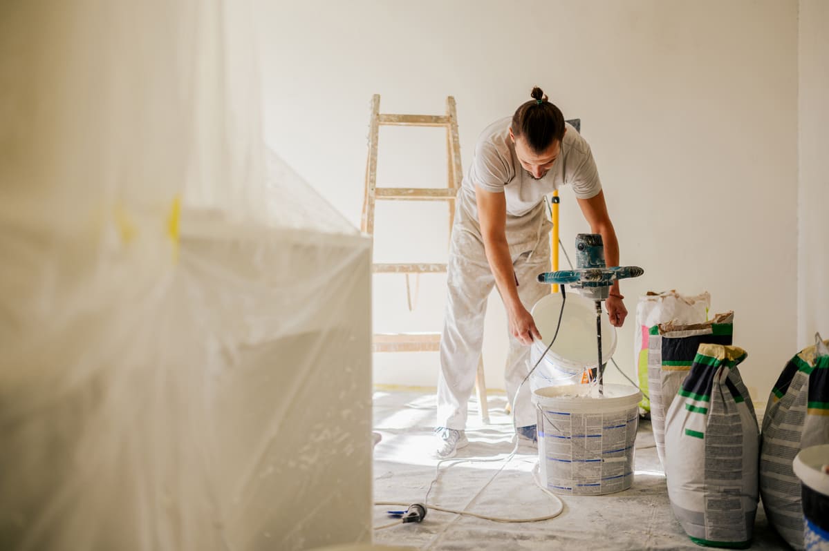 a-laborer-is-adding-water-to-a-plaster-mixture-whi-2025-04-01-13-04-32-utc (1) (1).jpg