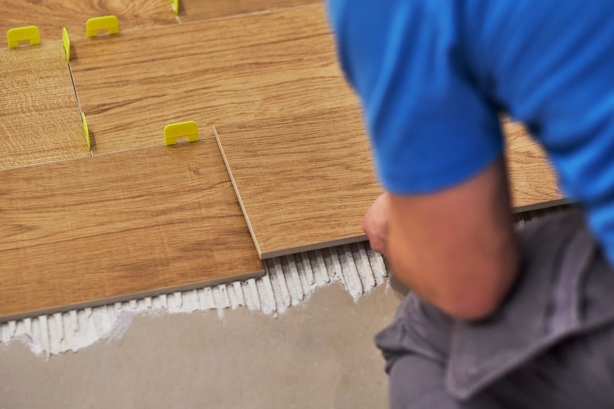 close-up-of-handyman-placing-tile-spacer-placing-2025-08-11-14-43-01-utc (1) (1).jpg
