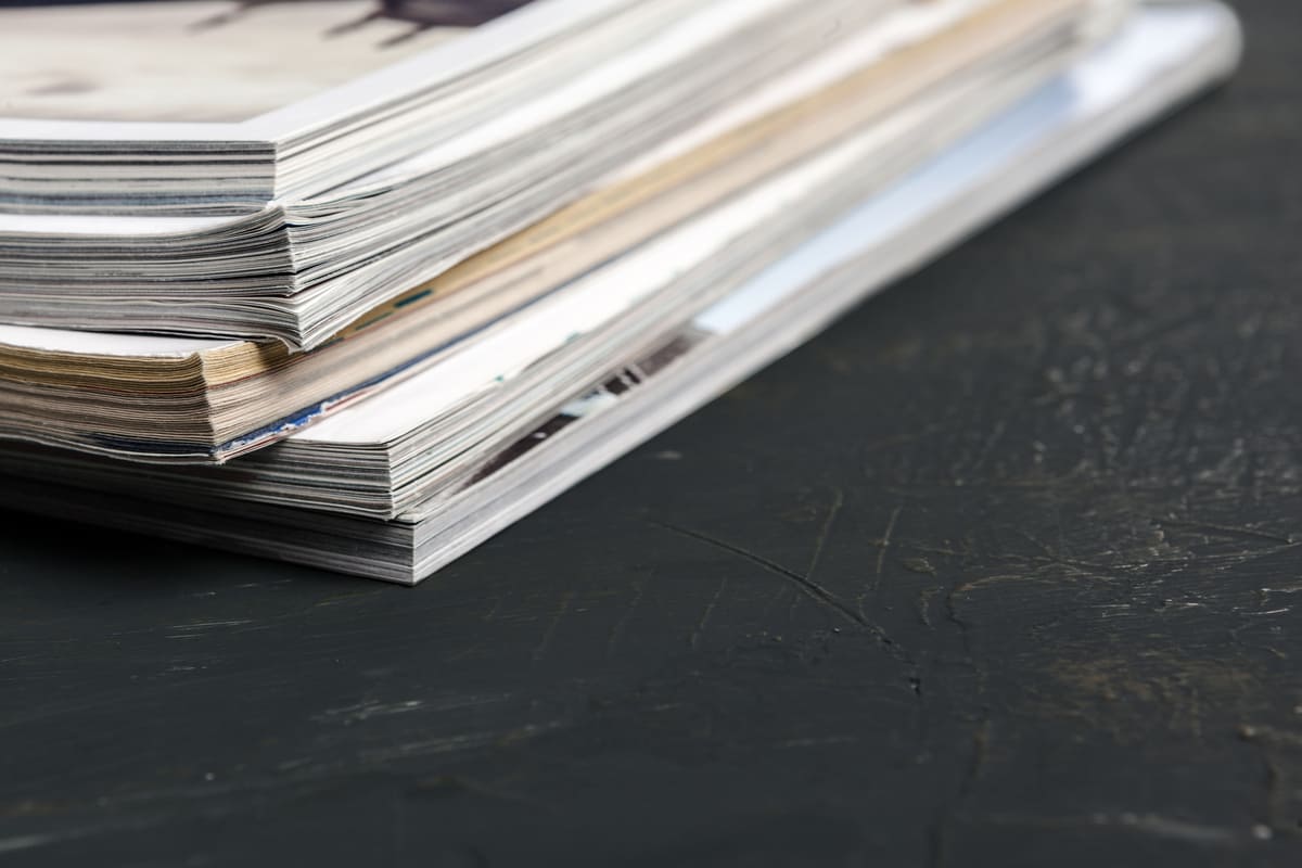 close-up-stacking-magazine-place-on-table-backgrou-2025-02-24-13-47-56-utc (1) (1).jpg