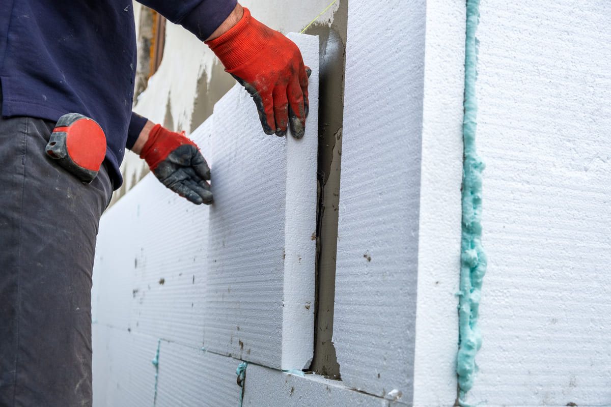construction-worker-installing-styrofoam-insulatio-2024-12-06-01-17-51-utc (1) (1).jpg