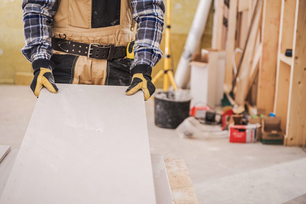 male-contractor-holding-piece-of-drywall-material-2025-04-02-07-51-44-utc (1) (1).jpg