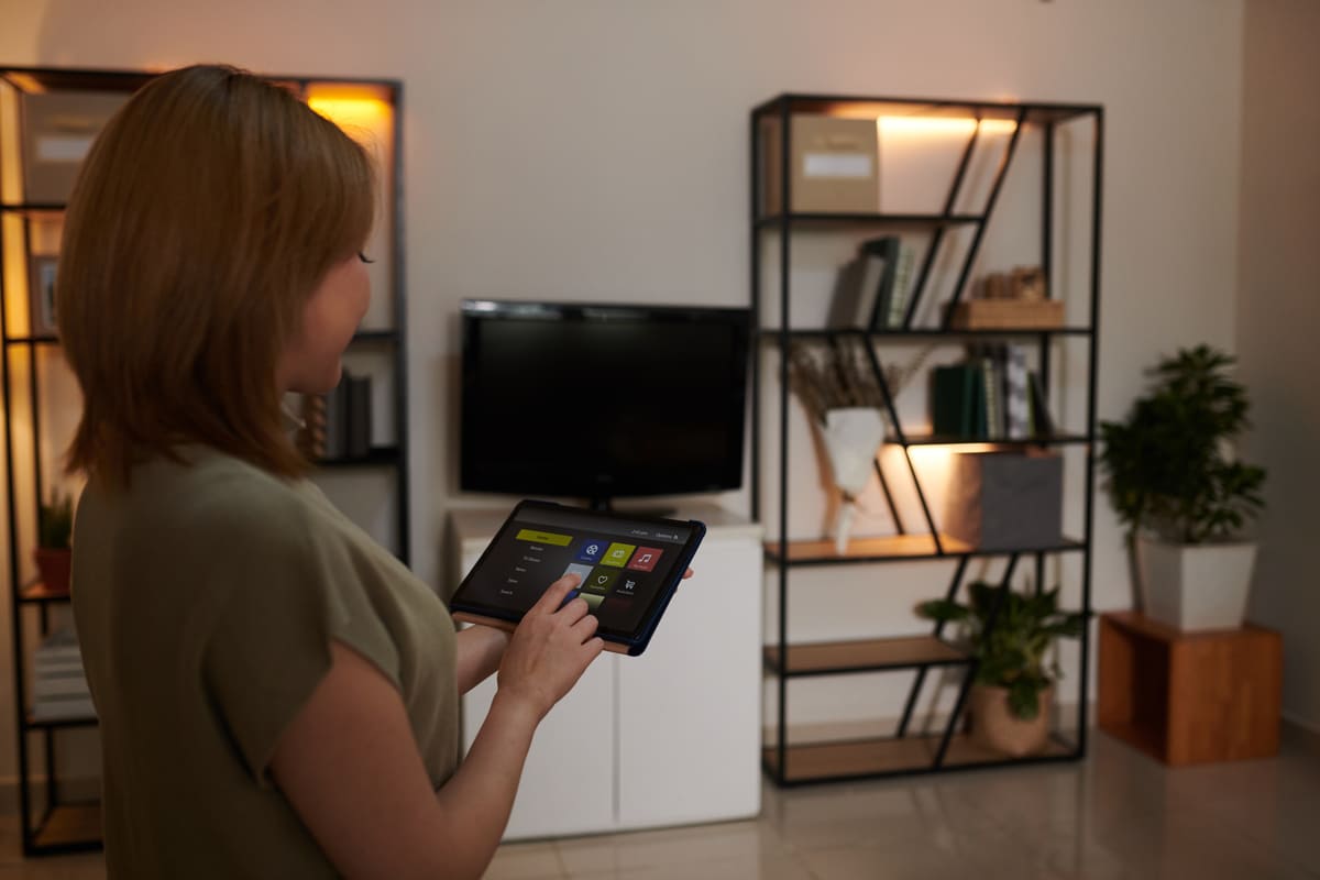 woman-dimming-lights-in-apartment-2025-02-11-12-47-29-utc (1) (1).jpg